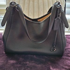 Coach Black pebble leather shoulder bag.